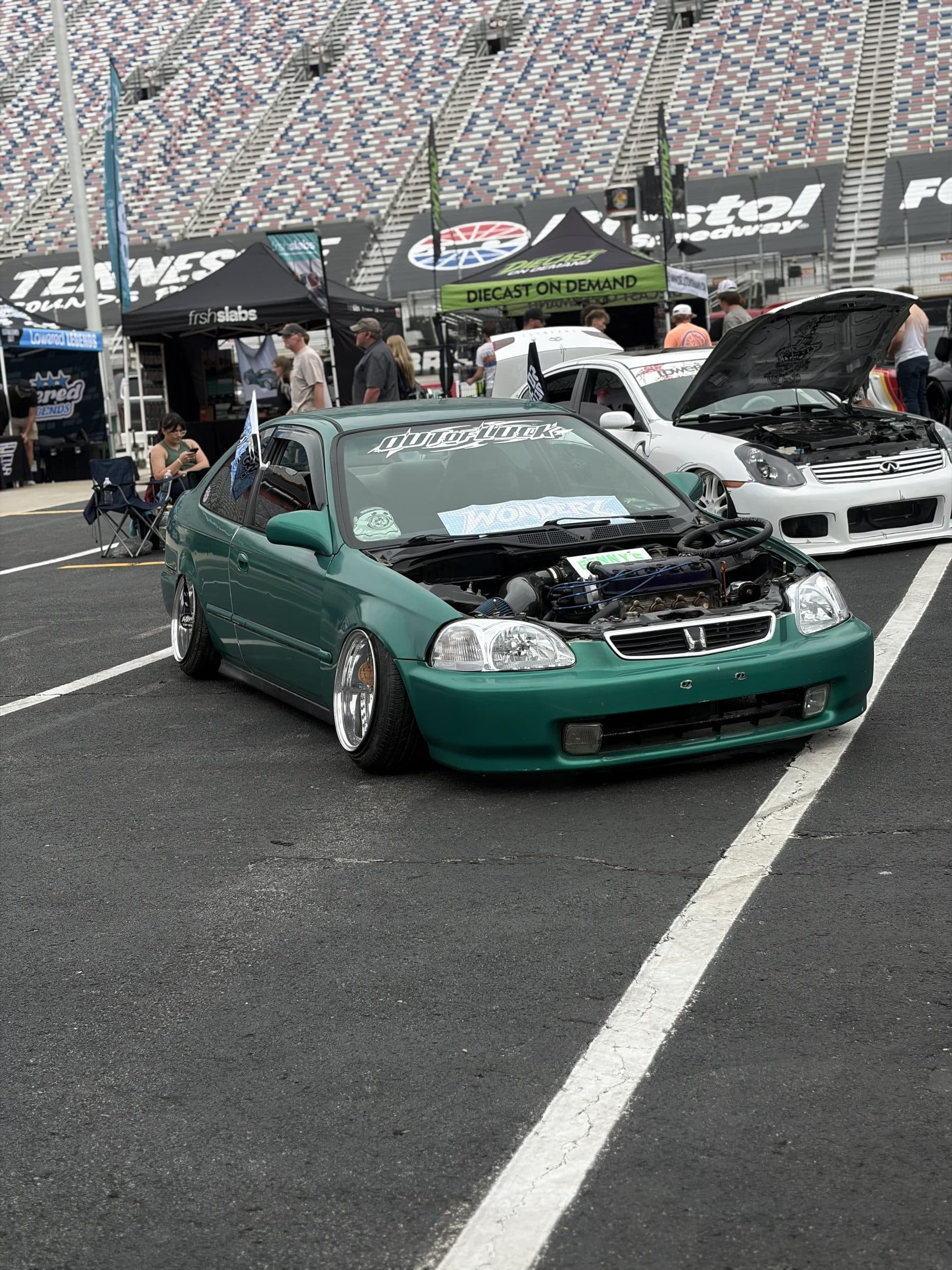 Front view of Garret's green Honda Civic coupe with its engine bay open