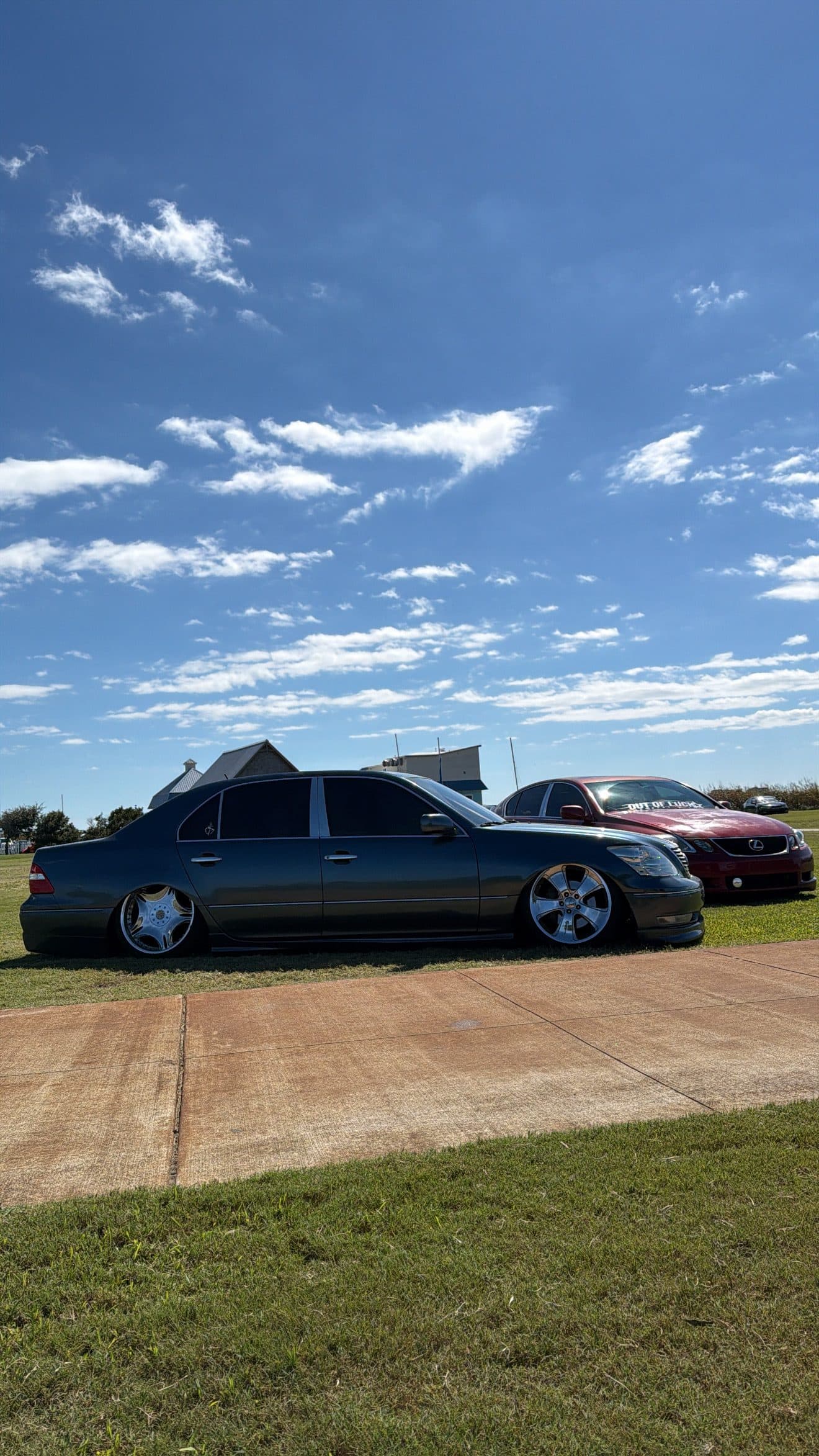 Side view of Juan's grey Lexus LS430 on a lawn on a sunny day