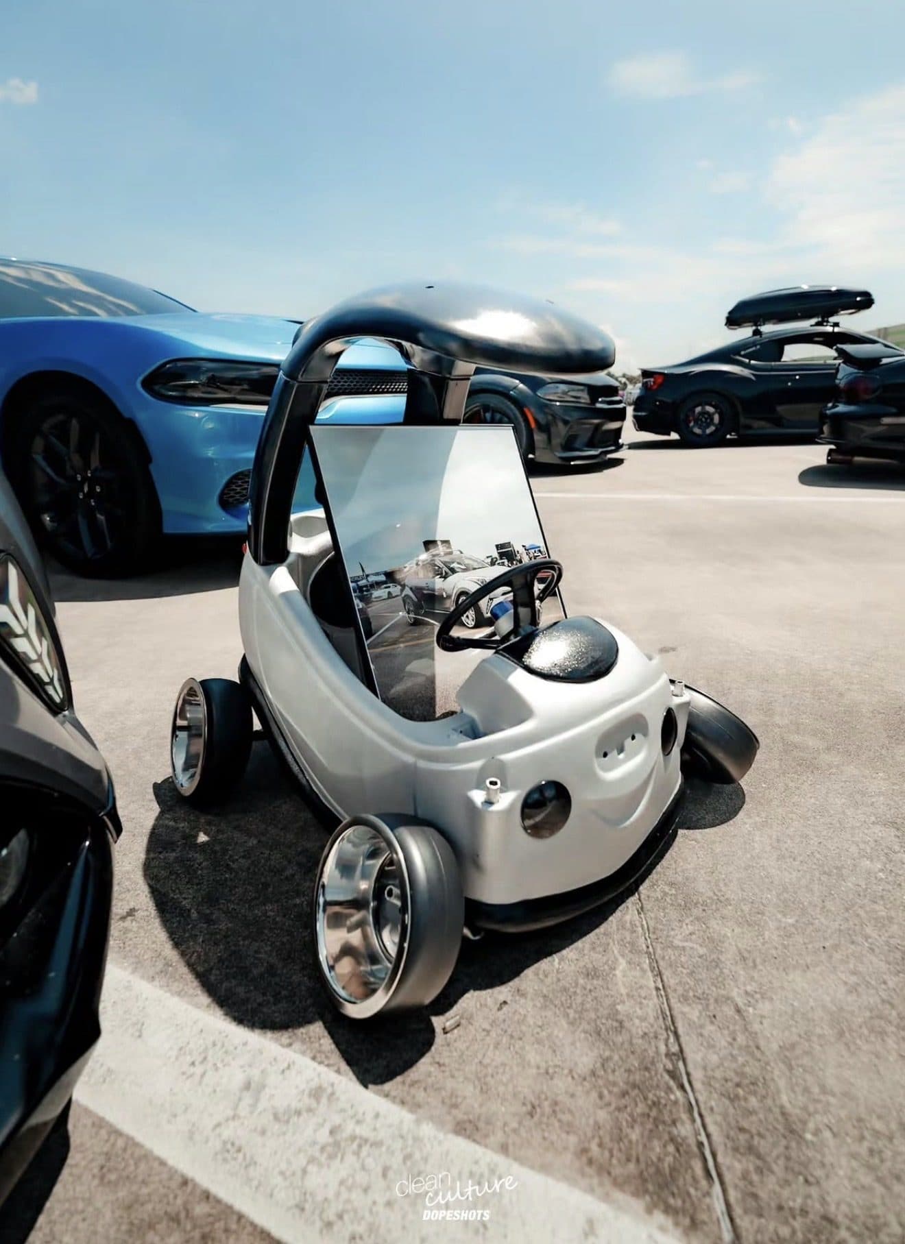 Martinez's modified mini ride-on car with polished wheels