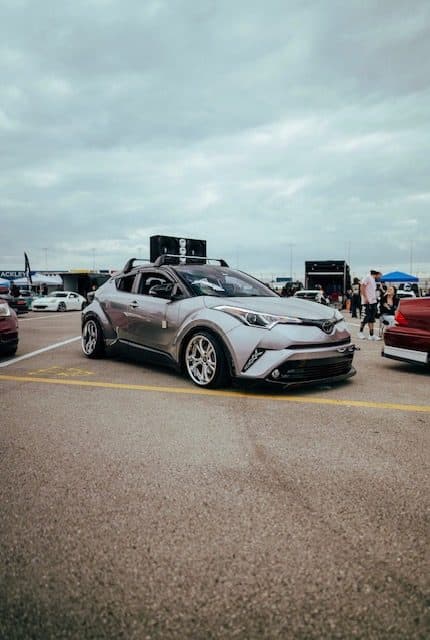 Martinez's silver Toyota C-HR with a roof box at an outdoor show